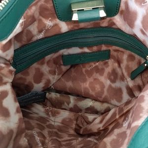 B. Makowsky green leather purse crossbody